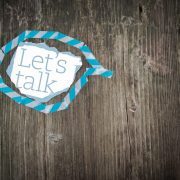 Let’s Talk – Sandra Harewood Counselling Let's Talk Note in Blue Speech Bubble on Wooden Surface -Worried About Your First Counselling Session? Here's How to Prepare - Sandra Harewood Counselling