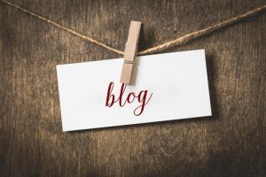 word blog on white card stock hanging from a clothespin on a clothesline - Blog - Sandra Harewood Counselling