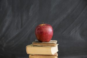 An apple on a stack of books and blackboard - An apple on a stack of books and blackboard - Appreciation - Sandra Harewood Counselling