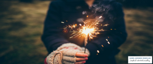 Woman holding a sparkler on a cold winter day - 3 Quotes For The New Year To Achieve The 2018 You Want - Sandra Harewood Counselling
