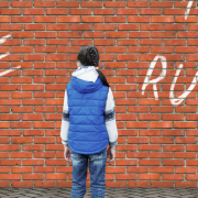Girl Standing In Front of Brick Wall With Graffiti - The B* Word - Boundaries. Why It's Hard To Stop Saying Yes When You Feel No 1 - Sandra Harewood Counselling