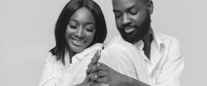 Black couple with secure attachment style and relationship holding hands, attachment styles matter -Sandra Harewood