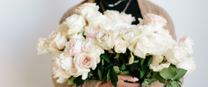 Woman Hold A Bunch of Pink Roses As A Self-Care Treat - New Year Self Care - Sandra Harewood Counselling