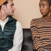 Mixed Race Heterosexual Couple Sitting On A Sofa looking Sad - Should I Stay or Should I Go- Quiz - Sandra Harewood