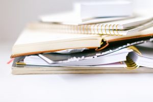 Stack Of Books For Journalling Habit - 5 Habits That Keep Your Marriage Stuck - Sandra Harewood