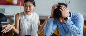 A heterosexual couple talking while arguing - how to improve communication in a relationship - Sandra Harewood Counselling