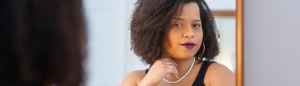 A Black Woman in a Tank Top Posing in Front of a Mirror -Self-Awareness Strengthens Your Marriage