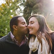 Boyfriend kissing his smiling girlfriend on the cheek Man Kissing His Girlfriend On The Cheek - Sandra Harewood