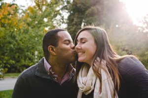 Man Kissing His Girlfriend On The Cheek - Sandra Harewood