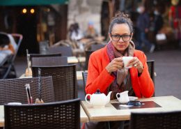 Thoughtful mature woman drinking tea in cafe - Individual v Couples Therapy - Sandra Harewood