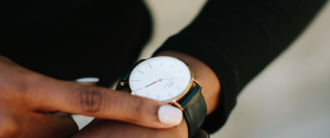 Black Woman Checking The Time On Her Watch Sandra-Harewood