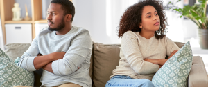 Unhappy Couple Having An Argument At Home - Why Do Couples Have Affairs? - Sandra Harewood
