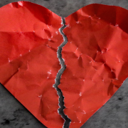 The Role of Therapy in Healing from Infidelity How to Recover and Rebuild Your Relationship – Sandra Harewood Red paper heart torn in half on dark background - How to recover and rebuild your relationship after an affair - Sandra Harewood