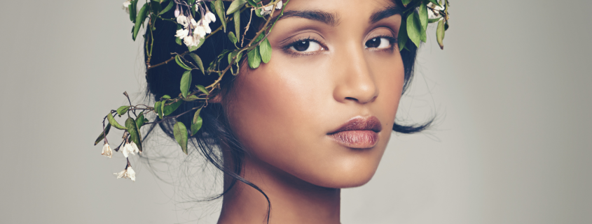 How Archetypes Can Help You Get Unstuck in Your Relationship - Woman of colour wearing a crown of flowers