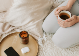 Woman on her knees holding a hot drink in a cup - 3 Steps to Finding Clarity While Stuck in Relationship Limbo