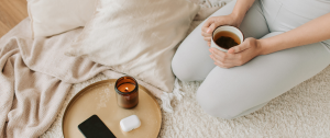 Woman on her knees holding a hot drink in a cup - 3 Steps to Finding Clarity While Stuck in Relationship Limbo