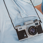 The Hidden Signs Your Relationship Is in Trouble—and What to Do Next Woman lying down with old fashion camera resting on her tummy - The Hidden Signs Your Relationship Is in Trouble—and What to Do Next - Sandra Harewood