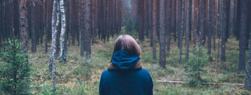 woman contemplating her relationship in the woods - Sandra Harewood