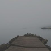 Pier at dusk symbolising the peaceful ending of a marriage A quiet pier at dusk over calm water, representing reflection, endings, and the possibility of peace after a marriage