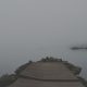 A quiet pier at dusk over calm water, representing reflection, endings, and the possibility of peace after a marriage