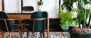 A stylish desk with three empty chairs in an office, representing negotiation, decisions, and the practical steps of ending a relationship.
