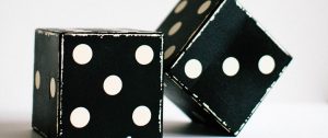 Two dice representing uncertainty in marriage and the emotional impact of infidelity