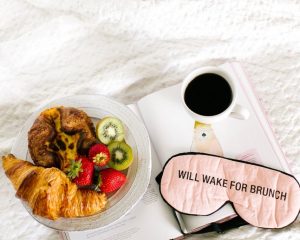 An eye mask with the words “Will wake up for lunch,” symbolising awakening to self-awareness and truth when feeling unhappy in my marriage.