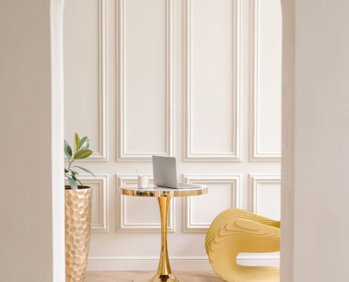 View through an open archway into a room with a gold table, symbolising openness and the possibility when sharing feelings in a relationship