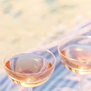 Early Signs of Drinking Too Much – Understanding Alcohol Dependency in Midlife Women Two filled champagne glasses and a bottle of champagne symbolising social drinking and the early signs of problem drinking in midlife women.