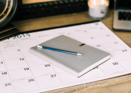 A closed journal and pencil on a desk, representing reflective journalling for relationship clarity.