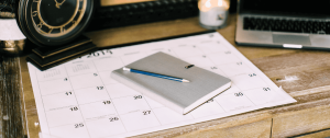 A closed journal and pencil on a desk, representing reflective journalling for relationship clarity.