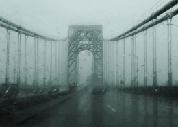 Mist-covered suspension bridge symbolising transition, uncertainty, and emotional thresholds within long-term relationships.